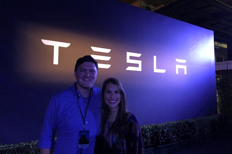 Taylor and Lauren standing in front of a Tesla sign at the Semi and Roadster unveiling