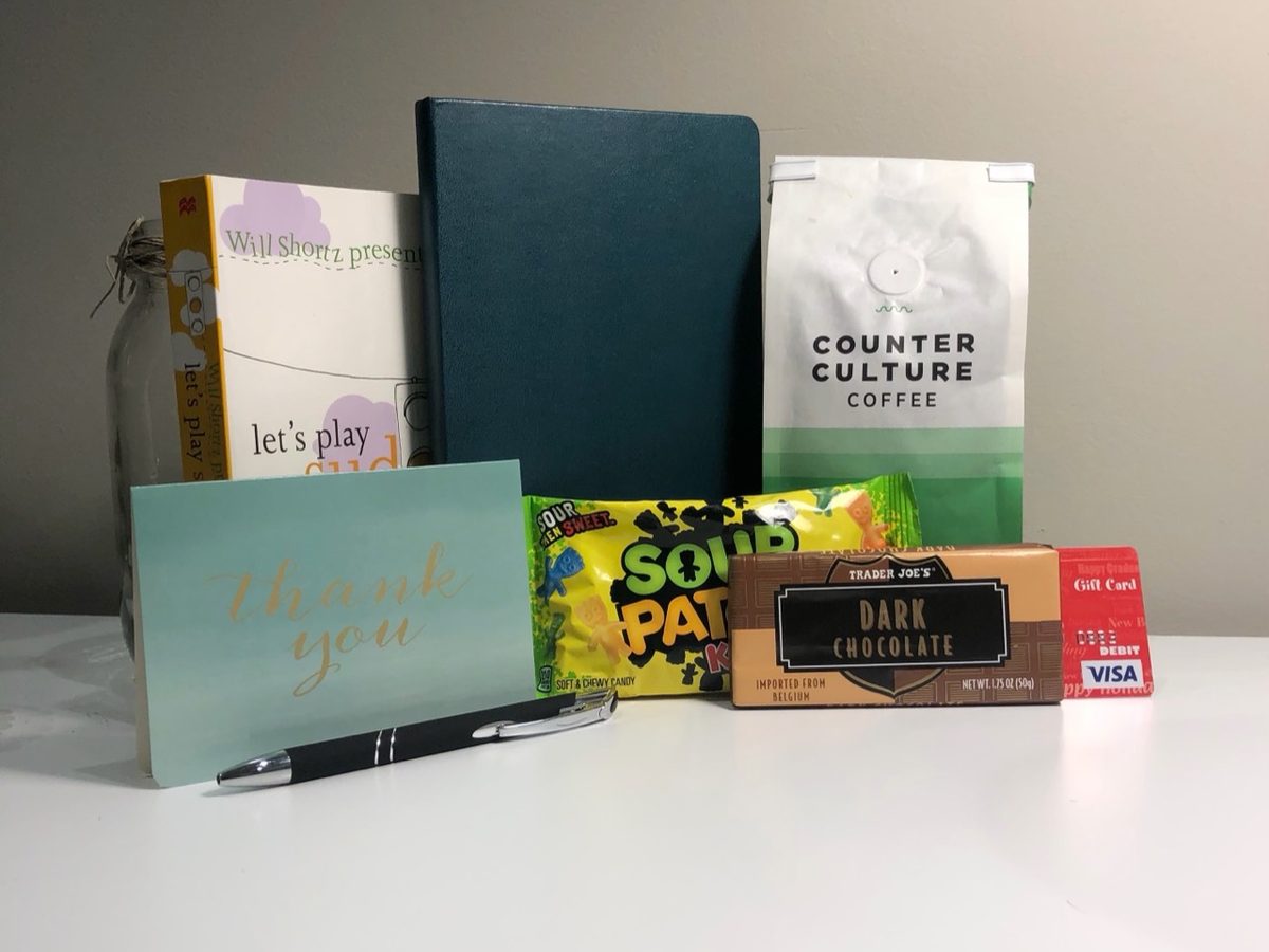 The V0 WFH Care Package with Counter Culture coffee, a notebook, games, candy, pen, and gift card